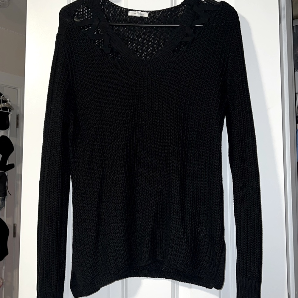 Medium black sweater with cutouts